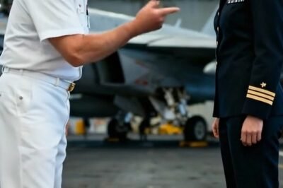 The hangar deck of the USS Intrepid has a sound you feel before you hear—metal straining, cables singing, the Pacific wind slipping under the massive bay doors like a living thing. It was the kind of morning that smelled of jet fuel and saltwater and consequence.
