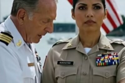 Memorial Day in Pensacola was supposed to be quiet—flags, folded hands, sunlight bouncing off the Gulf. And yet every head turned the moment she walked in.