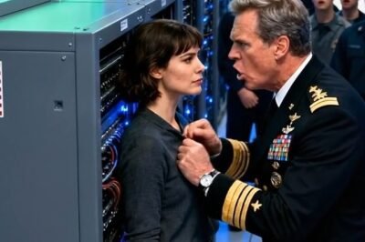 He shoved me against the steel wall like I was some intern who wandered into the wrong room… but the moment the alarms ignited and my tablet stayed the only calm screen in the chaos, his face told the truth—he’d just laid hands on the one person in the building he should’ve saluted.