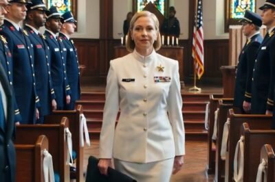 The chapel lights glowed against white lilies, steady and still—too still—like the room was holding its breath.