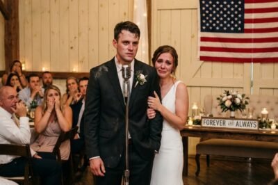 I MARRIED A MAN EVERYONE AT THE WEDDING CALLED “HOMELESS.” THEY LAUGHED. THEY WHISPERED. SOMEONE EVEN CLAPPED LIKE IT WAS A JOKE. THEN HE TOOK THE MICROPHONE—AND WITH ONE SENTENCE, THE ROOM COLLAPSED INTO SILENCE.